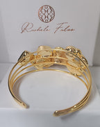 bracciale cuff dorato multifilo di Rachele Falvo con incastonati una perla barocca, un rubino grezzo, agate naturali e un'avventurina sfaccettata