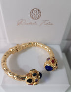 Bracciale rigido in stile bizantino placcato oro 24k di Rachele Falvo con quarziti blu e topazi colorati