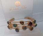 bracciale rigido a triplo filo dorato di Rachele Falvo con incastonate agate naturali multicolor