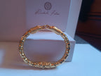 Bracciale serpente in oro galvanico su bronzo con tormaline rosa naturali