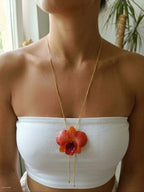 Collana saliscendi con vera orchidea arancione in resina
