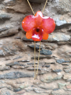 Collana saliscendi con vera orchidea arancione in resina