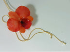 Collana saliscendi con vera orchidea arancione in resina