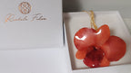 Collana saliscendi con vera orchidea arancione in resina