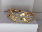 bracciale cuff a quattro fili dorati di Rachele Falvo con topazi naturali a taglio quadrato e elementi astratti lucidi