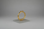 Bracciale etrusco rigido in oro opaco su bronzo con quarziti rosa naturali sfaccettate