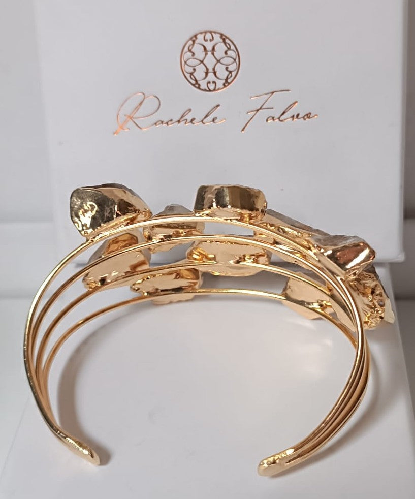 Bracciale rigido multifilo dorato firmato Rachele Falvo, impreziosito da luminose druse di quarzo bianco naturale