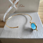 Bracciale in oro opaco su bronzo con occhio di gatto azzurro naturale sfaccettato