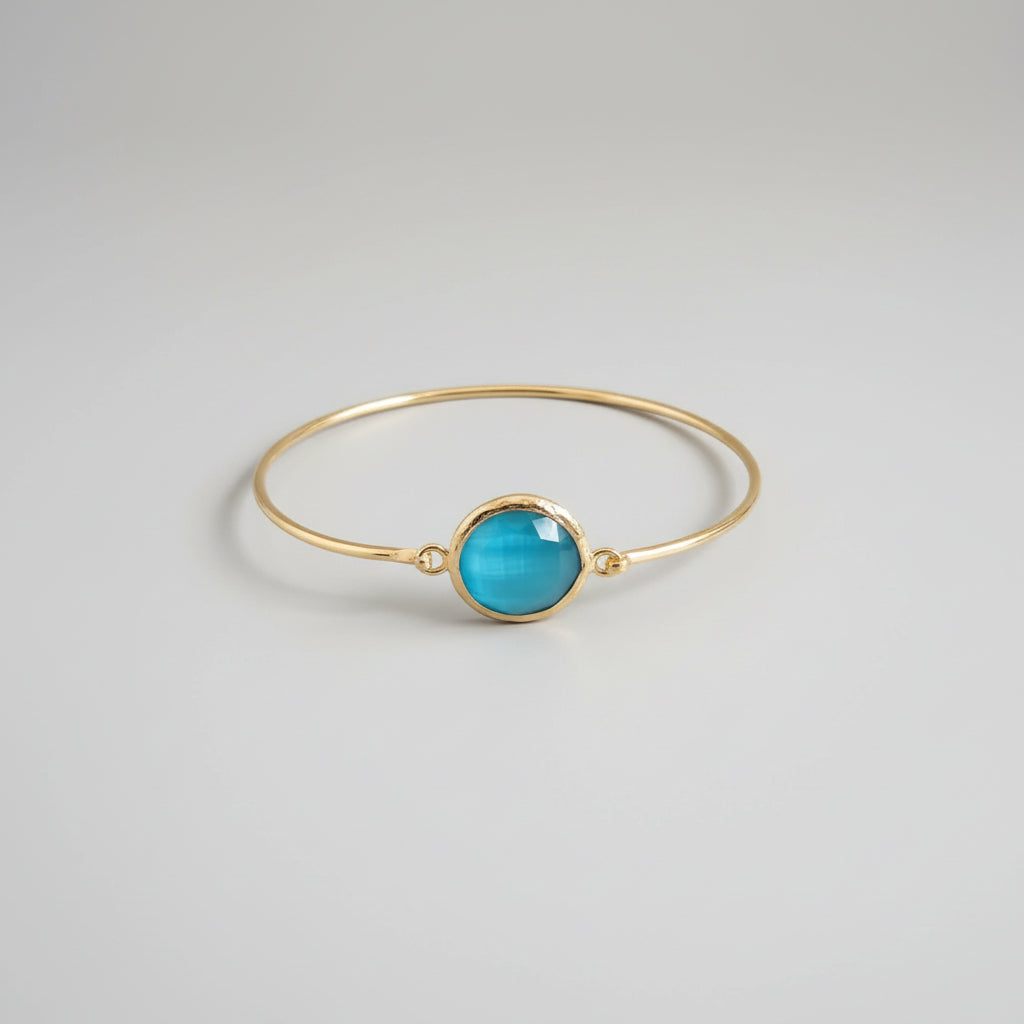 Bracciale in oro opaco su bronzo con occhio di gatto azzurro naturale sfaccettato