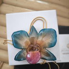 collana orchidea vera arancio azzurra stabilizzata resina