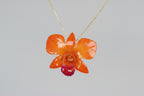 collana orchidea arancio resina effetto luminoso elegante gioiello solare per donna
