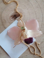 collana orchidea stellata bianca riflessi rosa resina saliscendi regolabile elegante