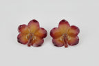 Orecchini con orchidea Vanda viola naturale inglobata in resina con ganci anallergici